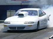 White Dodge Avenger Drag Car Doing Burnout