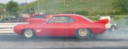 Red 1969 Camaro Doing Burnout