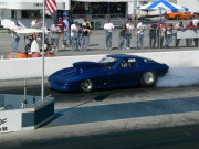 Dark Blue Corvette Doing Burnout