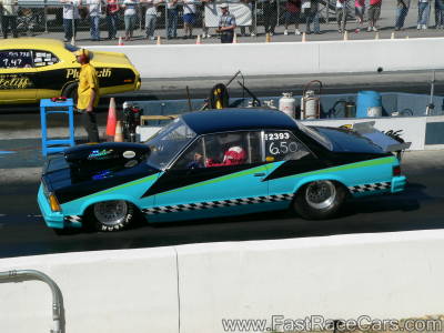Blue and Black Pontaic Grand Prix Drag Car