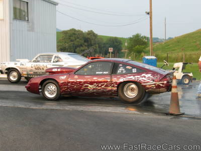 Burgundy and Silver MONZA Drag Car Doing Burnout