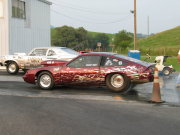 Burgundy And Silver Monza Drag Car Doing Burnout