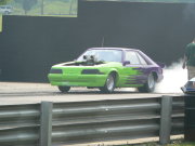 Green And Purple Mustang Drag Car Doing Burnout
