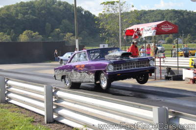 Purple 1967 Nova Popping Big Wheelie